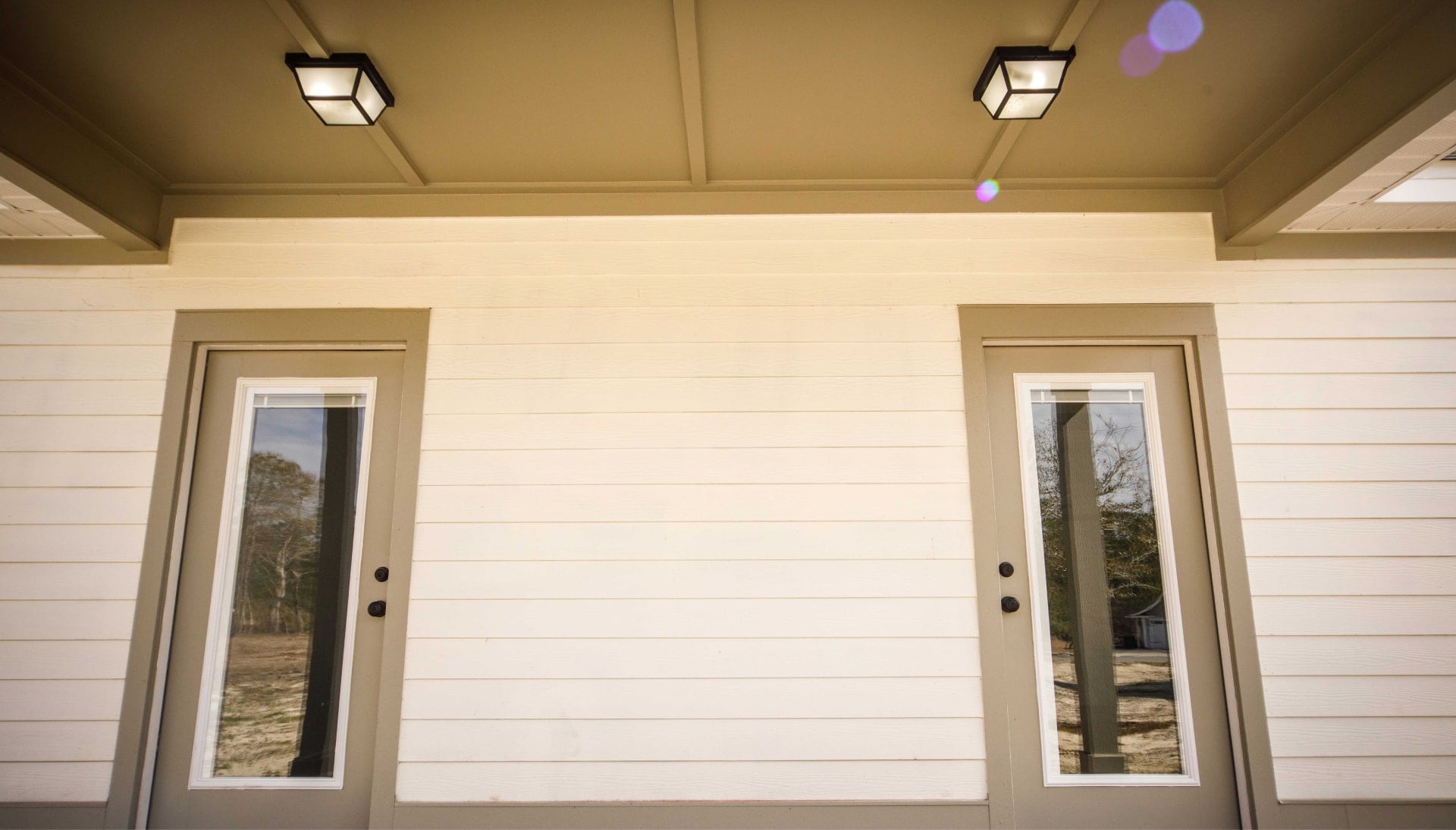 We offer siding services in Lubbock, Texas. Hardie plank siding installation in a front entry way.